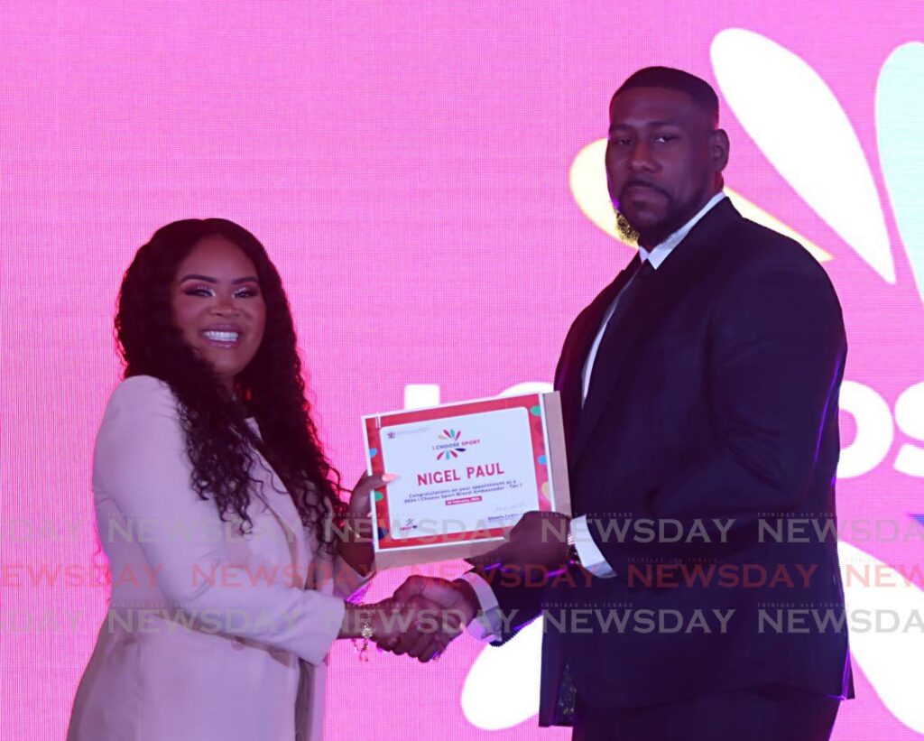 National boxer Nigel Paul, receives his 2024 I Choose Sport Brand Ambassador appointment, from Minister of Sport and Community Development Shamfa Cudjoe-Lewis, at Hyatt Hotel, Port of Spain on February 26. - Photo by Angelo Marcelle