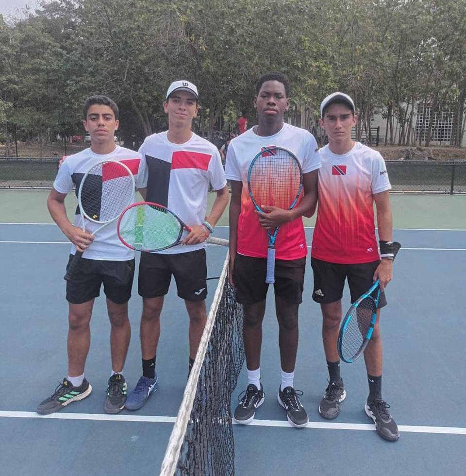 The Trinidad and Tobago doubles team of Kale Dalla Costa, right, and Jordell Chapman, second from right, defeated their opponents from Dominican Republic at the Junior Davis Cup. - 