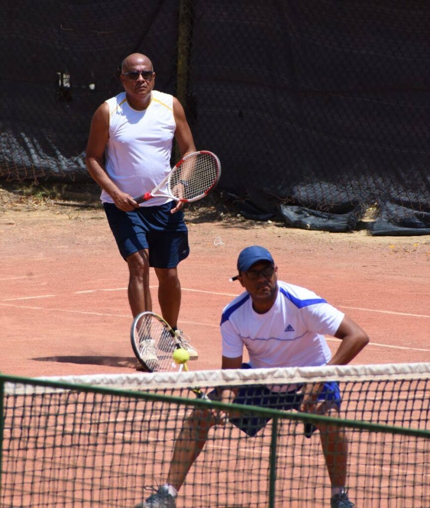 Collin Auguste, front, and his brother Dion Auguste in action at the ITF Tranquillity Masters, Victoria Avenue, Port of Spain, on February 25. -  