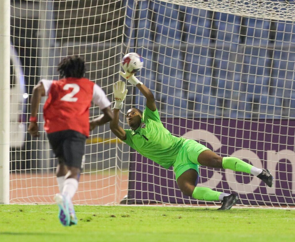 TT goalkeeper Ailan Panton attempts a save during the Concacaf Championship Group D qualifier against St Vincent and the Grenadines, on Friday, at the Hasely Crawford Stadium, Port of Spain. - Photo by Daniel prentice