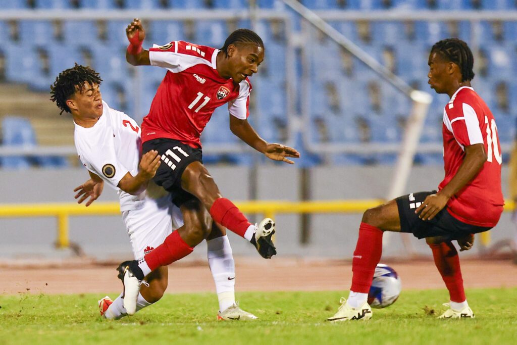TT U20 Derrel Garcia, right, gets past Canada’s U20 Theo Rigopoulos, during the Concacaf U20 qualifiers match at the Hasely Crawford Stadium, Port of Spain on February 27. - Photo by Daniel Prentice