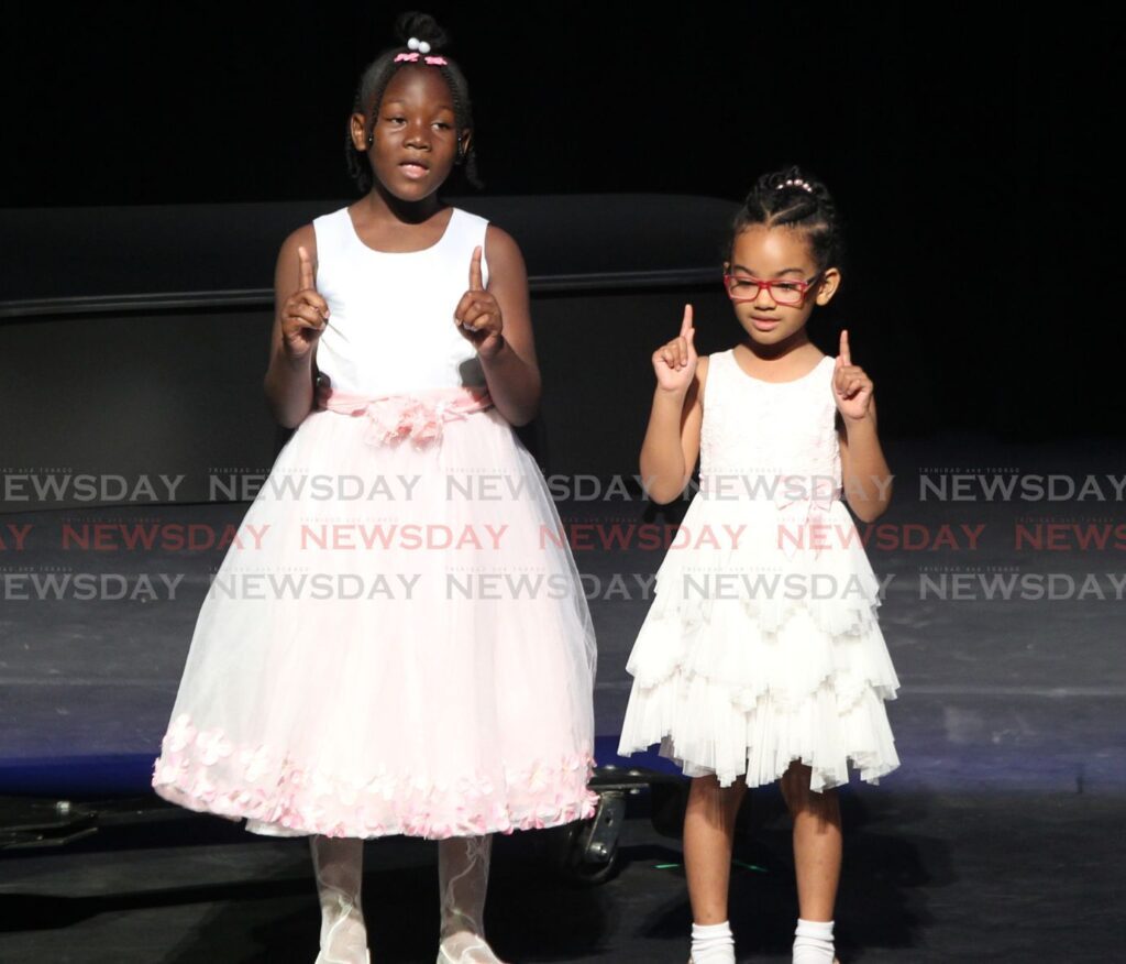 Ariah St.Hilaire and Aria Chan of Archer's Academy for the Performing Arts, perform their test piece, Ride with the Tide by Jay Althouse for the 35th Music Festival held at Queen's Hall, St. Ann's on February 26. - Photo by Faith Ayoung 