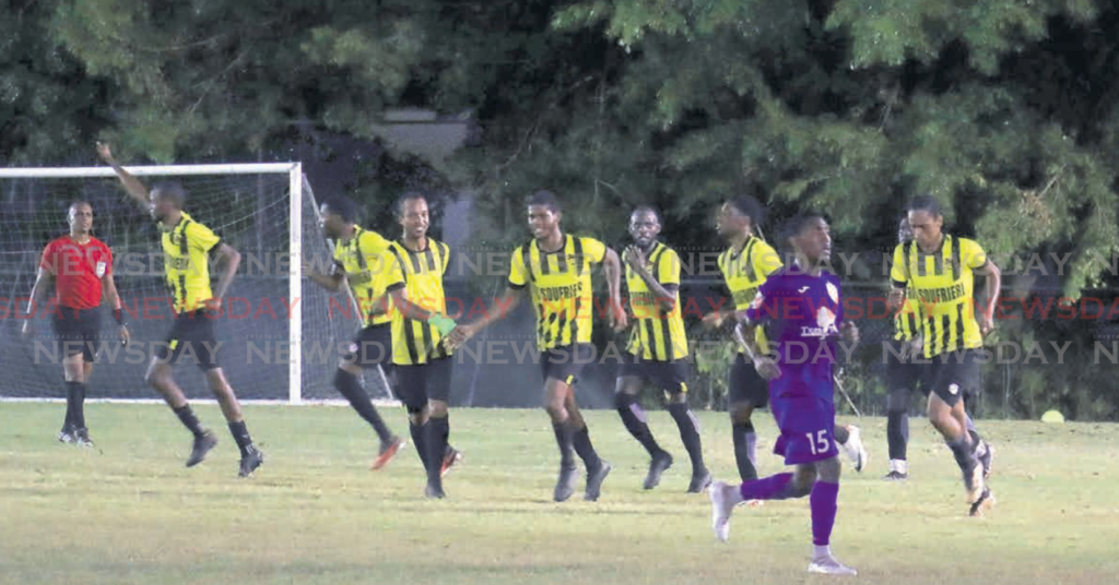 Central FC players celebrate a goal against AC Port of Spain, during a
TT Premier Football League match, on Fridat night, at the La Horquetta
Recreation Grounds, Phase II. PHOTOS BY Roger Jacob