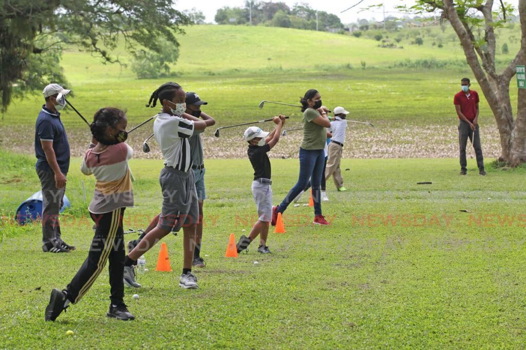 Junior golgers practise their golf swing at the St Madeleine Golf Course.  - Newsday File Photo