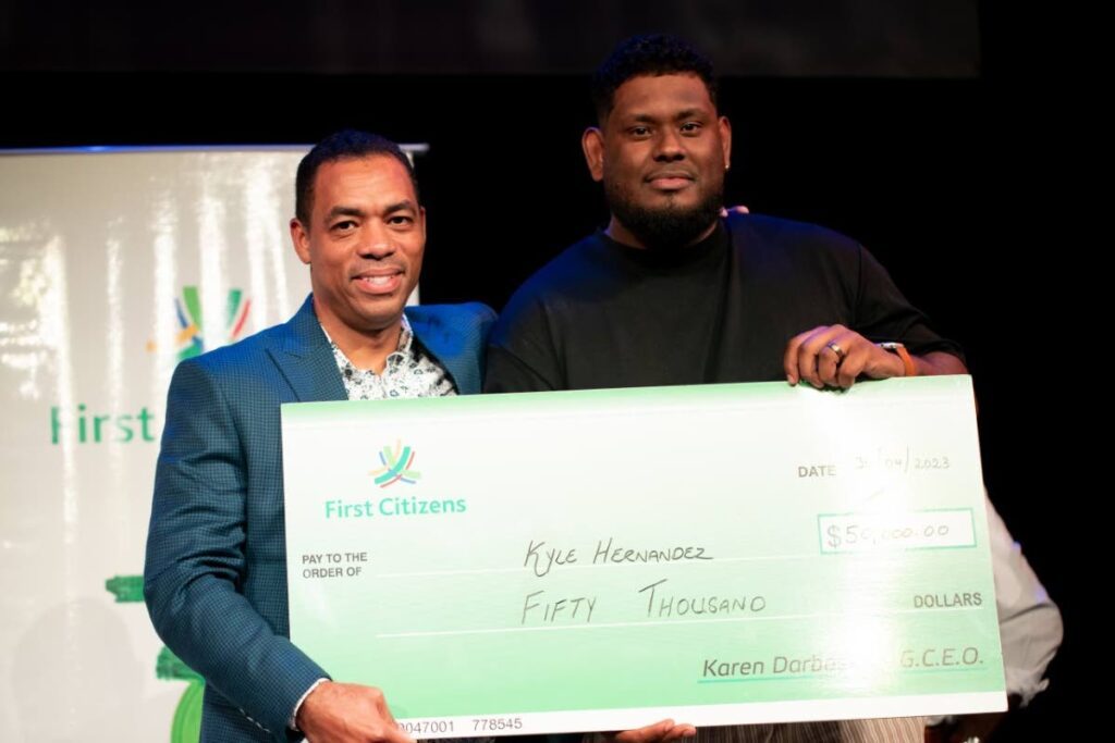 Defending First Citizens National Poetry Slam champion Kyle Hernandez, right, and group deputy CEO – business generation of First Citizens Group Jason Julien at the 2023 prize-giving event. - 