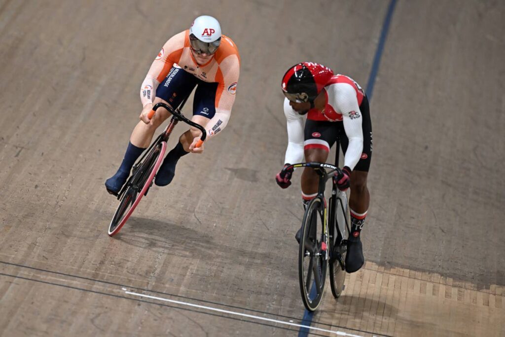 Netherland's Jeffrey Hoogland, left, stalks Trinidad and Tobago's Nicholas Paul in their 1/8 final of the men's Elite Sprint at the Sir Chris Hoy velodrome during the 2023 UCI Cycling World Championships in Glasgow, Scotland.  - 