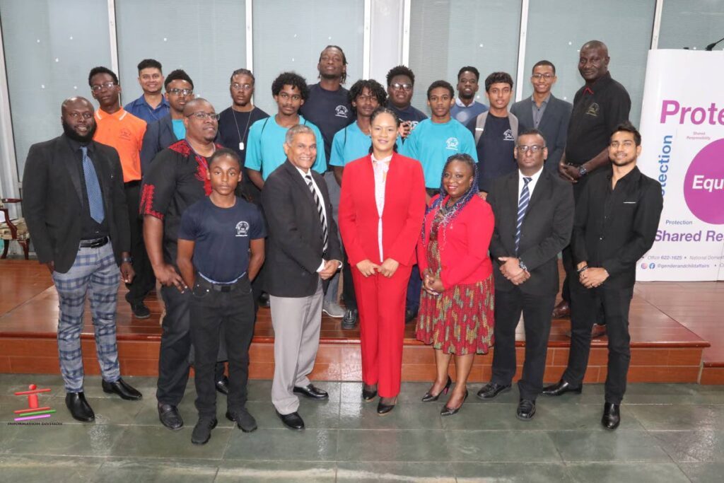 Minister in the Office of the Prime Minister with responsibility for Gender and Child Affairs, Ayanna Webster-Roy (centre, front row); with Vijay Gangapersad, Acting Permanent Secretary in Gender and Child Affairs (front third from left);  Marlon Bascombe, Country Director, USAID, Y-RIE (front second from left); Shelley-Ann Hart, Director, Gender Affairs Division (front third from right); and Sanjay Singh, Deputy Permanent Secretary, Gender and Child Affairs (front second from right) with panellists, students and teachers in attendance at the Youth Tech Initiative on February 28, at the Gender and Child Affairs Division’s St Clair office. - 