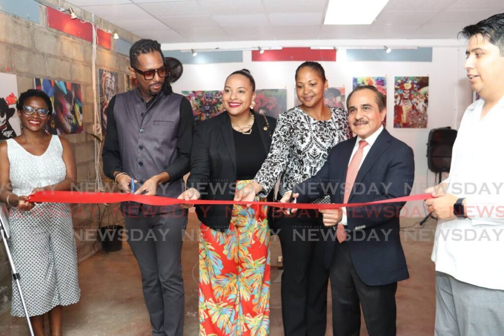 Kevon Gareth Foderingham, founder of East Yard; Jeniece Scott, councillor for Calvary; and Mexico ambassador Victor Hugo Morales cut the opening ribbon at the Death on the Skin photography exhibition at East Yard - Joki One on Prince St, Arima, on February 26 - GREVIC ALVARADO