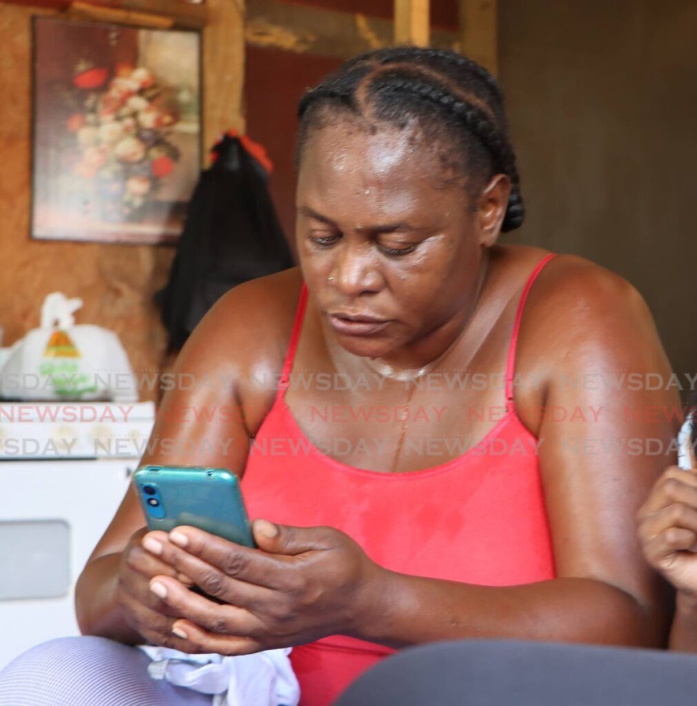 Kizzy David, mother of 96.7fm DJ Elijah ‘Sugars’ Babb, speaks highly of her son at their Laventille home on March 3. Babb was gunned down in Laventille earlier that day.  - Photo by Angelo Marcelle