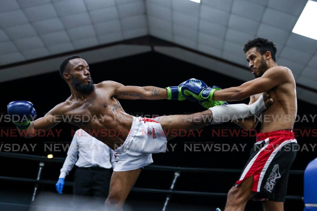 Davin Sinaswee, left, of Prodigy Fight and Fitness kicks Joshua Garcia of Rough House Training Center during Fight Night 33. - Photo by Daniel Prentice