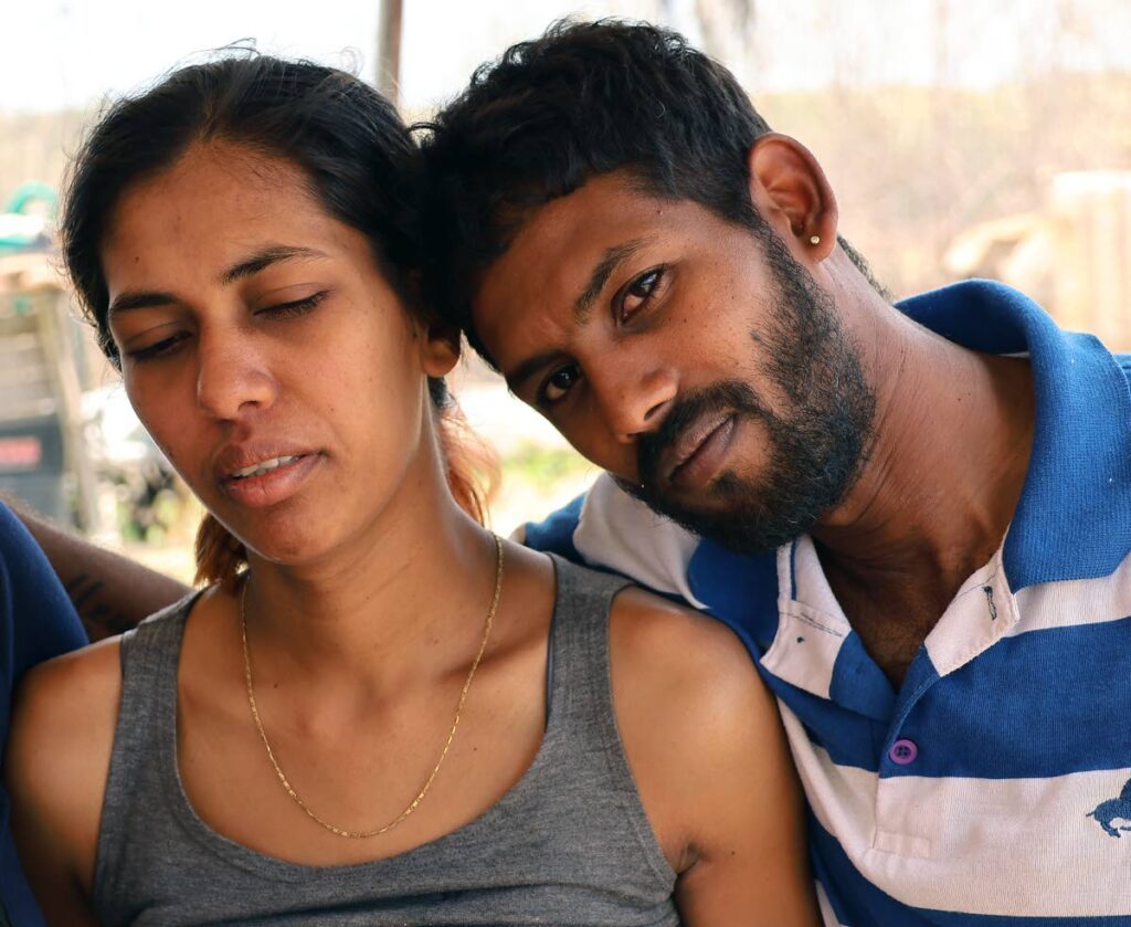 Roshanie Ramrahal and Brandon Doodnath grieve the loss of their daughter, Amy Rianna Doodnath, at their home on Bunsee Trace, off Penal Rock Road, Siparia. - Photo by Lincoln Holder 