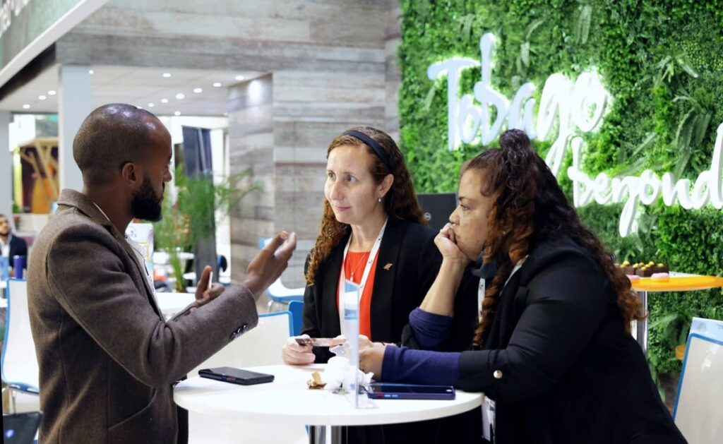 Manta Lodge manager Paige Ramnath, right, and Hadco Experiences’ Rachael Nathaniel, listen to a visitor at the Tobago patio at the 2024 ITB Berlin trade show in Germany. - Photo courtesy Office of the Chief Secretary's Facebook page