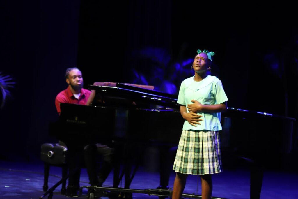 Jinaliah Beckles performs the test piece On The Good Ship Lollipop in the girls’ vocal solos 11-12 years category at the start of the TT Music Festival championships at Naparima Bowl on Monday.  - Courtesy TT Music Festival  