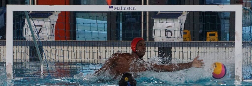 Queen's Royal College goalkeeper Kerne Dick attempts a save during the Republic Bank Secondary Schools Water Polo Leagye open male final against Fatima College at the National Aquatic Centre in Couva on March 10. 