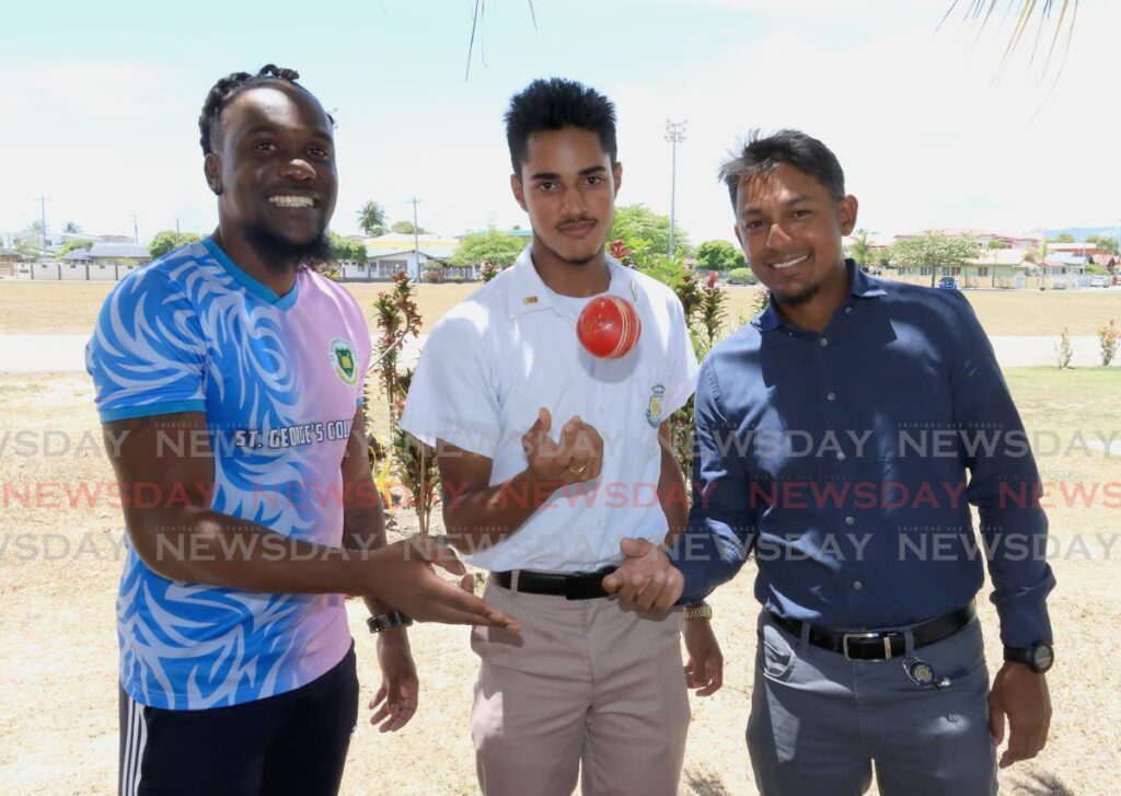 St George’s physical education teacher Anderson Harry (L) and coach Zaheer Mohammed (R) surround St George’s cricketer Akash Singh at the school grounds, on March 12. - ROGER JACOB