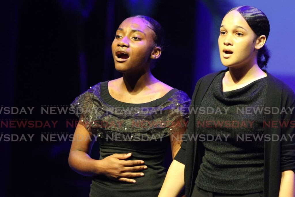 Gianna Griffith, left, and Za'ariah Balkissoon of St Joseph's Convent, San Fernando, sing Andrew Lloyd Webber's Pie Jesu at the TT Music Festival, Naparima Bowl, San Fernando, on March 12. - Photo by Lincoln Holder 