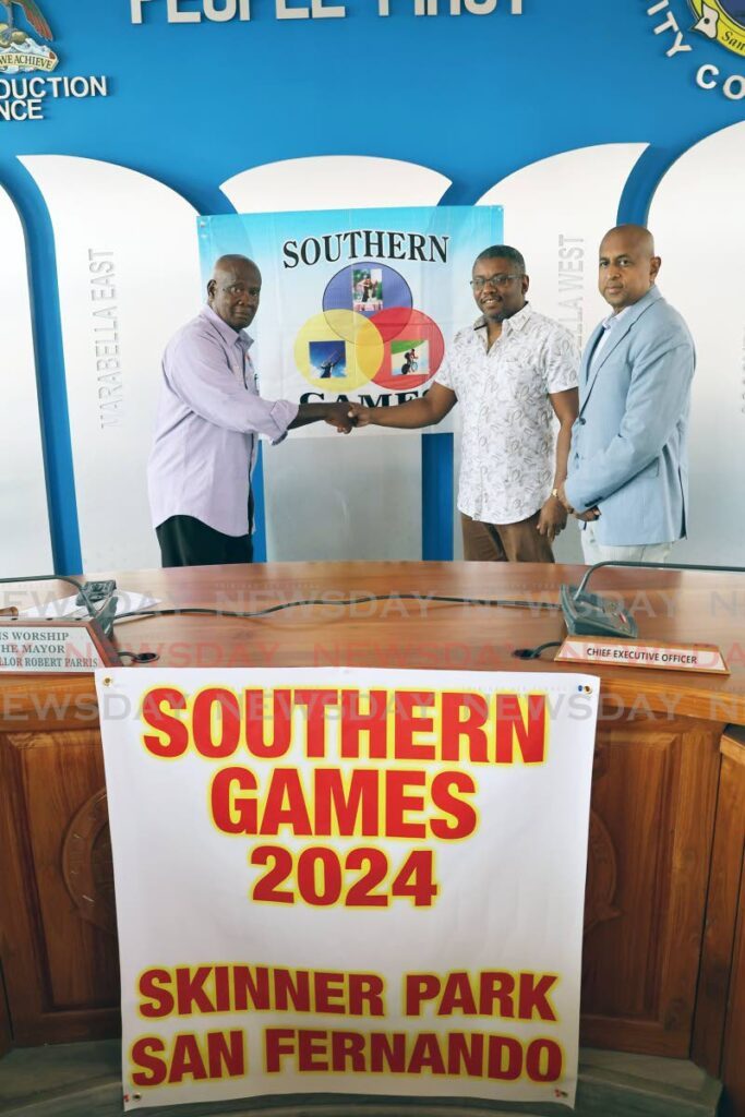 Chairman of the Southern Games Committee Anthony Commissiong (L) greets San Fernando Mayor Robert Parris and chairman of Youth and Sport at the San Fernando City Corporation Alderman Daniel Dookie (R) at the 2024 Southern Games launch, on March 13, at City Hall, San Fernando. - Photo by Lincoln Holder 