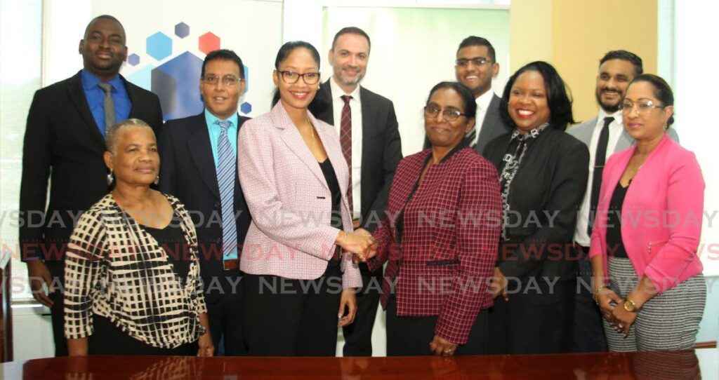From front left, Christine Frank, National Insurance Fund Holding Company Ltd.( NIF), Eva Mitchell, CEO of Trinidad and Tobago Stock Exchange (TTSE) and Trinidad and Tobago Central Depository (TTCD), Jennifer Lutchman, Chairman (NIF), Cindy Pierre, State Counsel II (Ag.), Treasury Solicitor’s Department , Ministry of Finance (NIF), Tisha Marie Millington Beharry, General Manager (TTCD), Jason Dyer, Information Technology Manager (TTSE), Dexter Jaggernauth, Acting Permanent Secretary, Ministry of Finance (NIF), Daniel Youssef, Head of Wealth Management at First Citizens Brokerage and Advisory Services (FCBAS), Yuri Seedial, Brokerage Manager (FCBAS) and Jase Torry, Market Operations Manager (FCBAS) together at the NIF2 Bond listing cermony at Nicholas Towers, Port of Spain on March 13. - Photo by Faith Ayoung