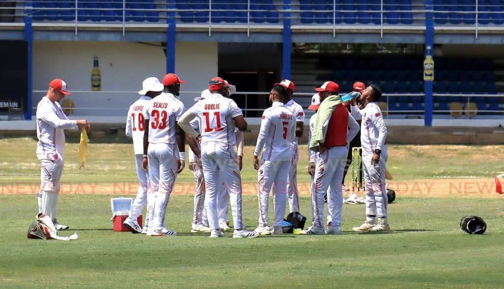 TT Red Force cricketers gather during the CWI Regional Four-Day match, on March 13, against Windward Islands Volcanoes, at the Queen’s Park Oval, St Clair.  - ROGER JACOB