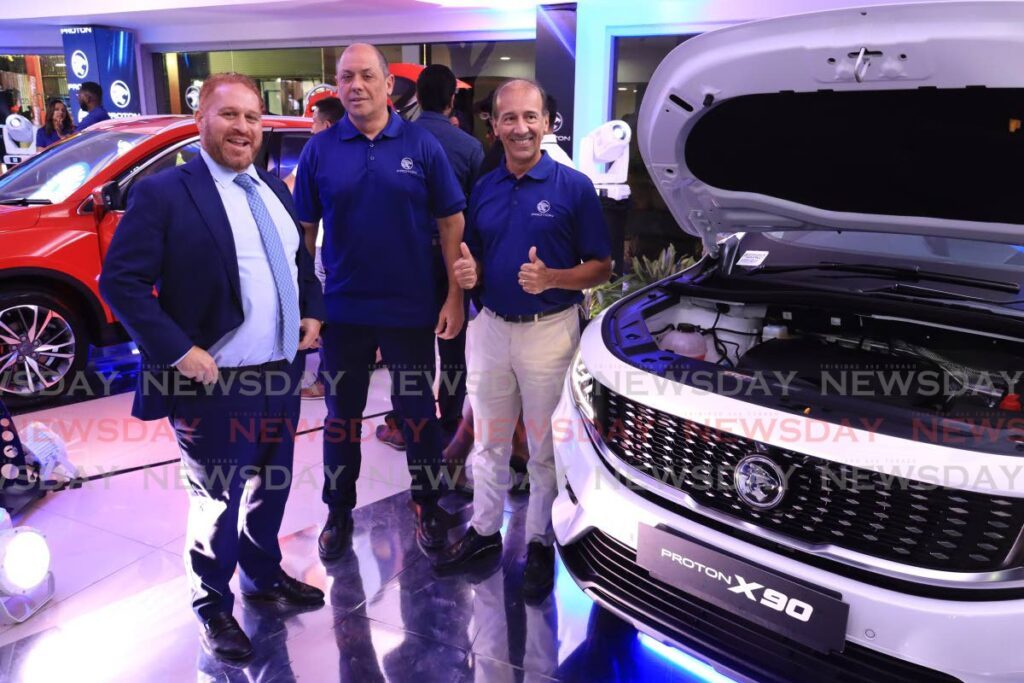 Anthony Sabga III, CEO of Ansa McAl Group, left, alongside Jerome Borde, Ansa Motors head-regional business and Jean-Marc Mouttet, Ansa Motors sector head, at the launch of the Proton automobiles at Ansa Motors Showroom, Charles Street, Port of Spain on March 13. - Photo by Roger Jacob