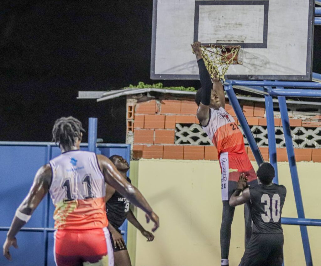 Spartans TT's centre Jahiem Harry with a put-back dunk in the DIAL Basketball tournament recently.  - 