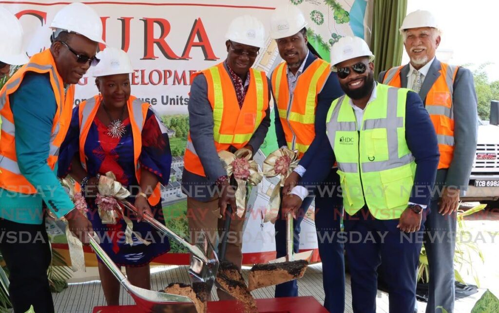 From left: Tunapuna MP Esmond Forde, Housing Minister Camille Robinson-Regis, Prime Minister Dr Keith Rowley, Minister in the Ministry of Housing Adrian Leonce, Tunapuna/Piarco Regional Corporation chairman Desell Josiah Austin and HDC chairman Noel Garcia turn the sod  for the Caura Housing Development, Caura Royal Road, El Dorado, on March 19. - Photo by Angelo Marcelle