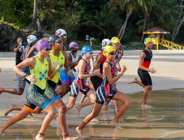 Participants sprint to the water during the TTTF National Aquathlon Championships