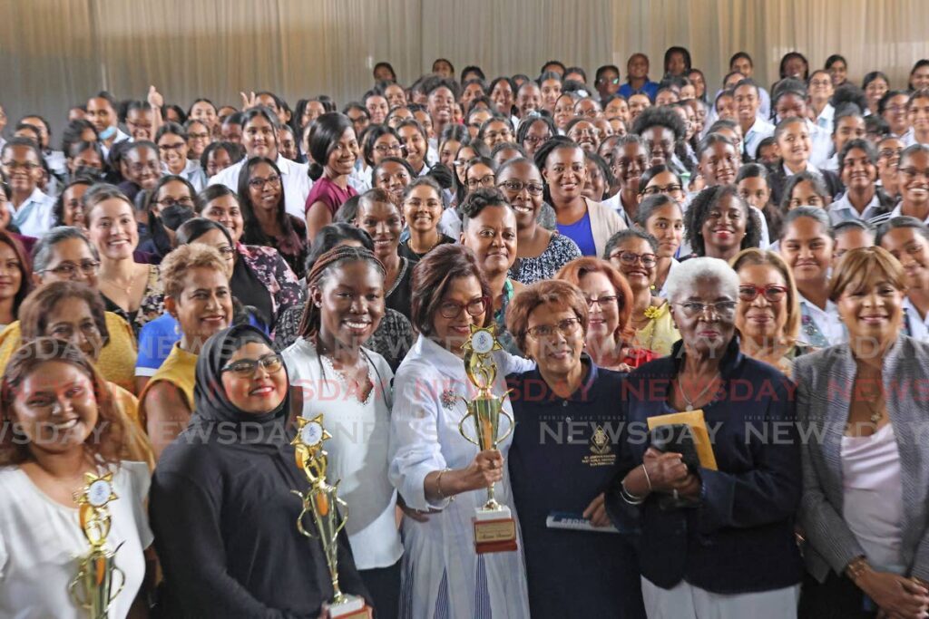 PRESIDENT AND FUTURE: President Christine Kangaloo, centre, with teachers and students at her alma mater, St Joseph's Convent, San Fernando, as they celebrate St Joseph's Day at the school on Harris Promenade on March 19. - Photo by Lincoln Holder