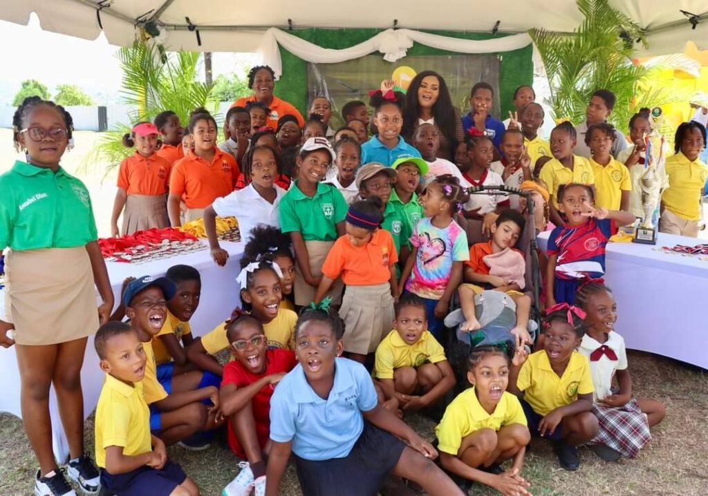 Participants, officials and Minister of Sport and Community Development Shamfa Cudjoe-Lewis at Irvine's School Golf Intercol 2024, at Shaw Park Ground, Scarborough on March 18. - 