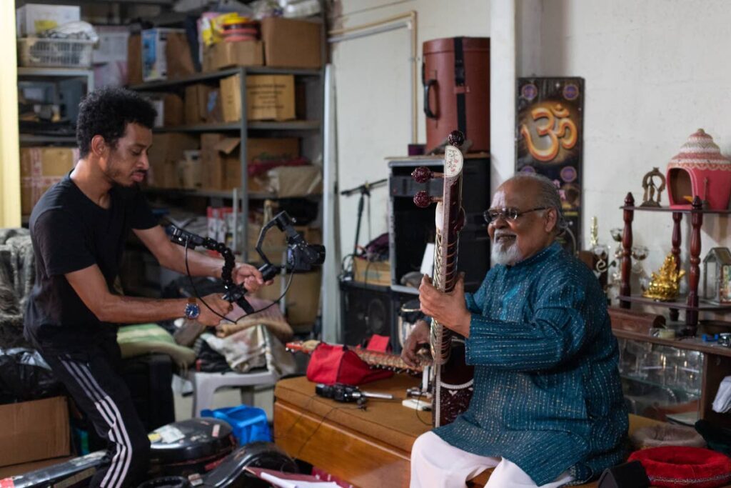 Mikhail Gibbings films Mungal Patasar playing sitar - Photo Courtesy Teneka Mohammed