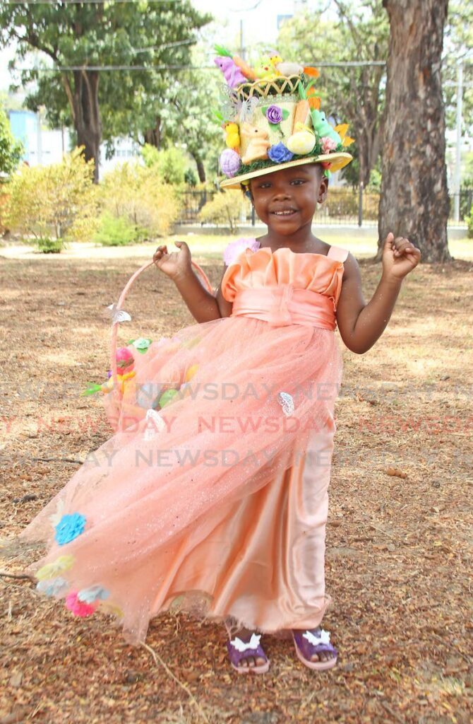 Moahirah Williams, 3, of St Martins Welfare Association Early Childhood Centre wows with her Easter hat and basket with decorations flowing onto her dress as well.  - Photo by Faith Ayoung