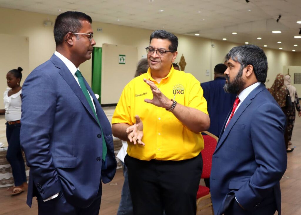 Mayaro MP Rushton Paray, centre, speaks with attorneys Larry Lalla, SC, left, and Kiel Taklalsingh at the Couva Chamber of Commerce Hall on March 22. - Photo by Ayanna Kinsale  