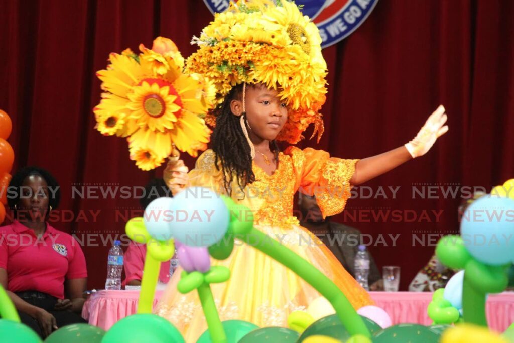 Celebrit-T Charles, 6, poses on stage in her costume titled, Easter Sunrise to Sunset for the Easter Bonnet Parade and Competition at City Hall, Port of Spain on March 22. - Photo by Faith Ayoung