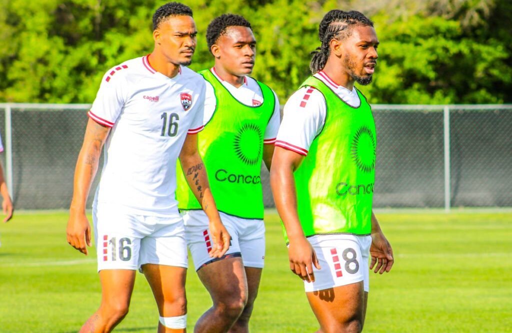 Soca Warriors players (from left) Alvin Jones, Jesse Williams and Daniel Phillips at a training session on Friday in Texas. - Photo courtesy TTFA