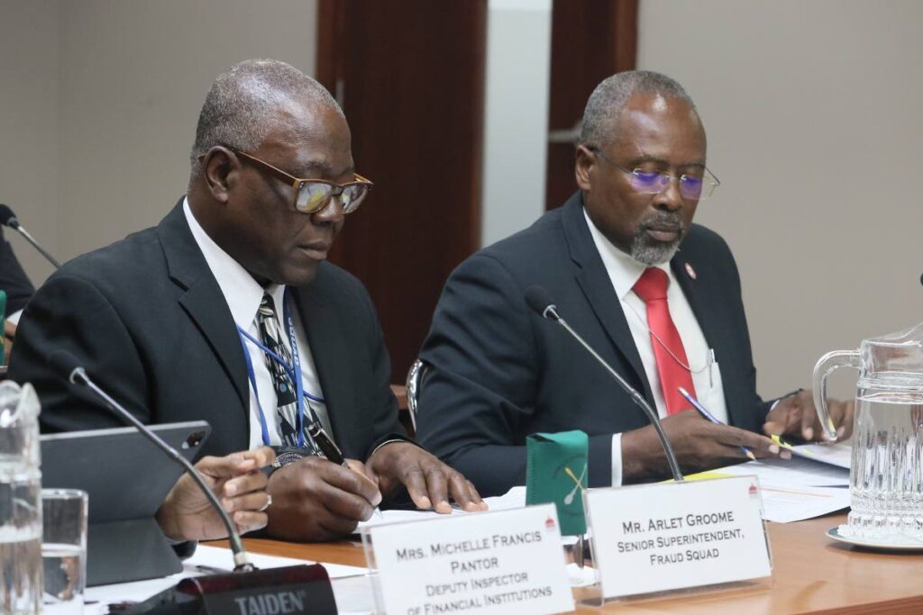 Snr Supt Arlet Groome of the Fraud Squad, left, and Director of the Financial Intelligence Unit Nigel Stoddard during the JSC in Parliament on March 22.  - Photo courtesy Parliament