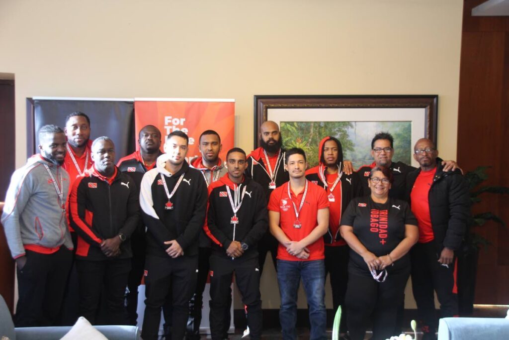 Hockey World Cup-bound Team TT, including coach Raphael Govia, second from right, back row, at the VIP Lounge, Piarco International Airport on Sunday morning, after returning from Canada where they placed second in the Indoor Pan Am Cup.  - Photo courtesy SporTT
