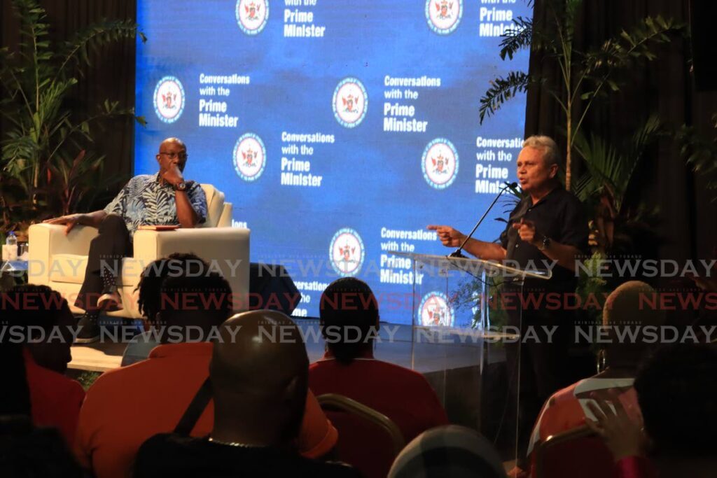 GOOD POINT, COLM: Prime Minister Dr Keith Rowley looks on as Finance Minister Colm Imbert speaks at Conversations with the Prime Minister, held at Exodus panyard, Tunapuna on March 26. - Photo by Roger Jacob