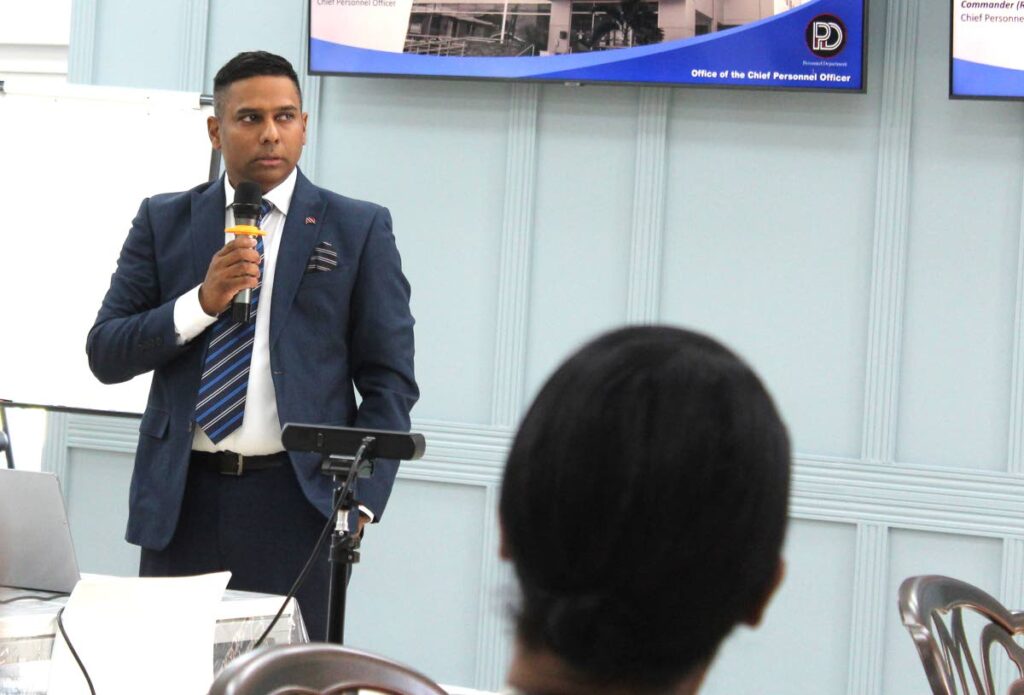 Chief Personnel Officer, Dr Daryl Dindial, speaking to staff on the department’s new structure on March 22 at the CPO Wellness and Conference Centre. - 