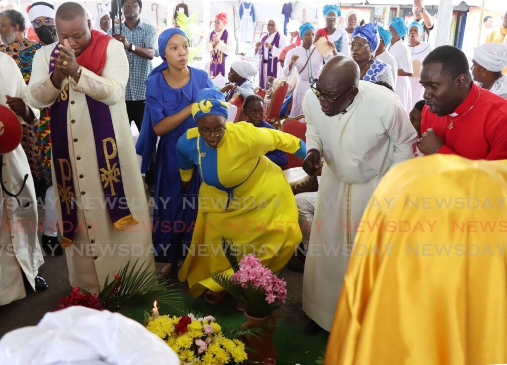 The Spiritual Shouter Baptists engaged in worship and jubilation at the Spiritual Shouter Baptist Liberation Day celebration at the Spiritual Baptist Administrative Complex in Balmain, Couva on March 30. - Photo by Ayanna Kinsale