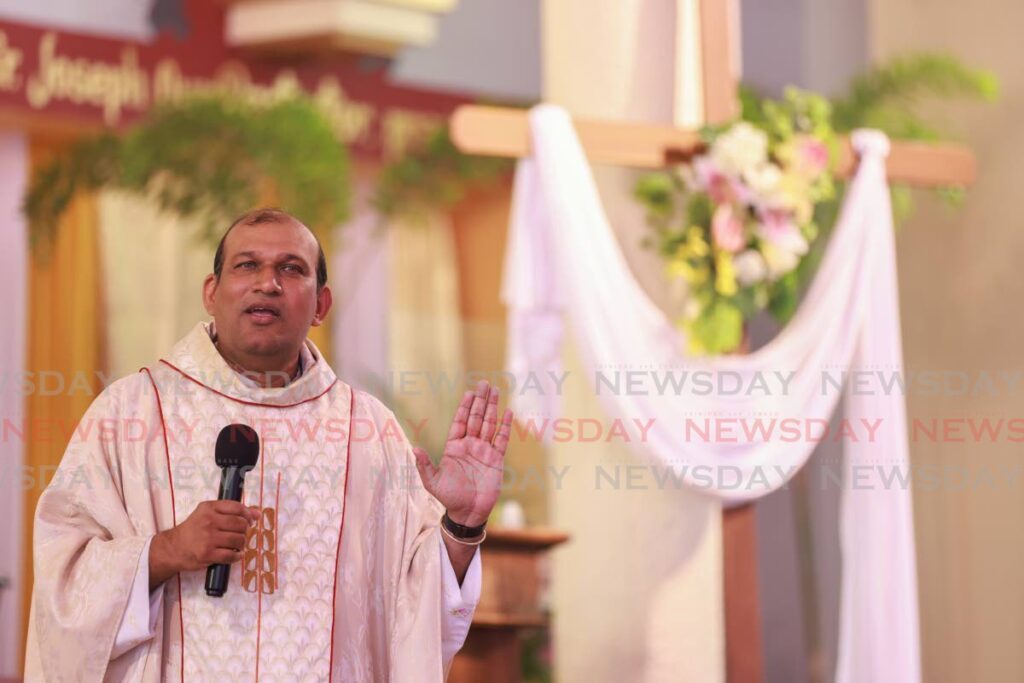Father David Khan leads the Easter Sunday service at the Lady of Perpetual Help, San Fernando on March 31 - Photo by Jeff K. Mayers