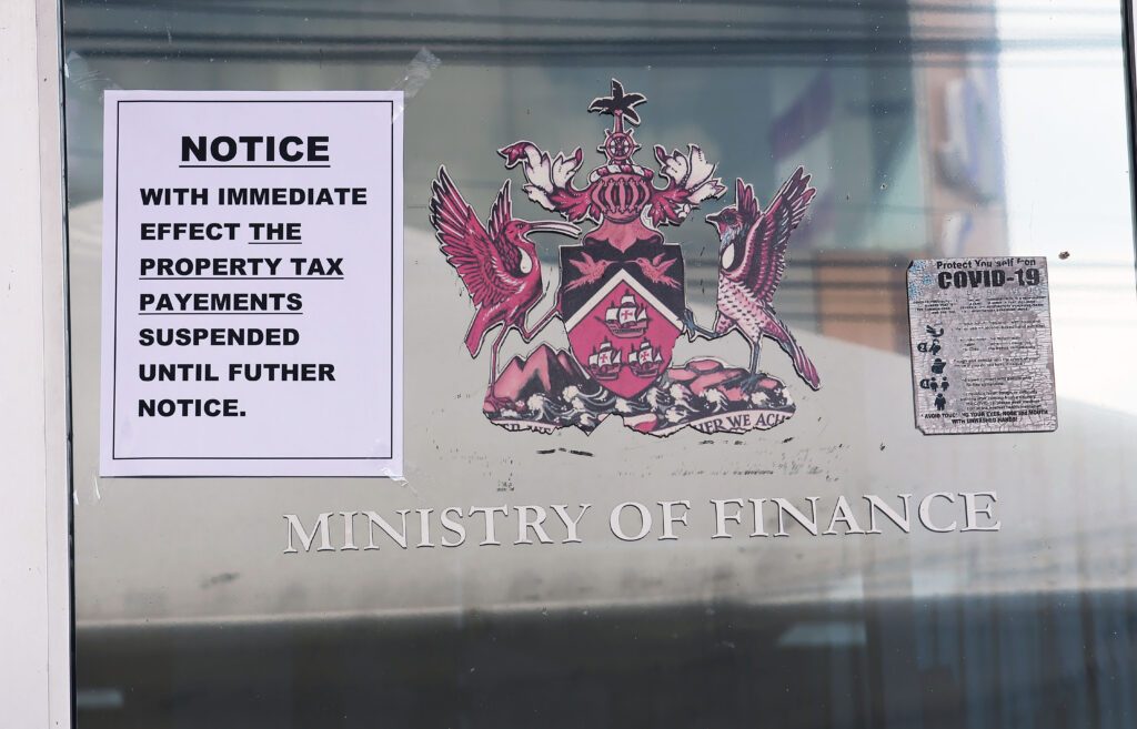 A notice was placed on the door of the Board of Inland Revenue building on Cipero Street, San Fernando about the suspension of payments for property tax on March 14. - Photo by Lincoln Holder. 