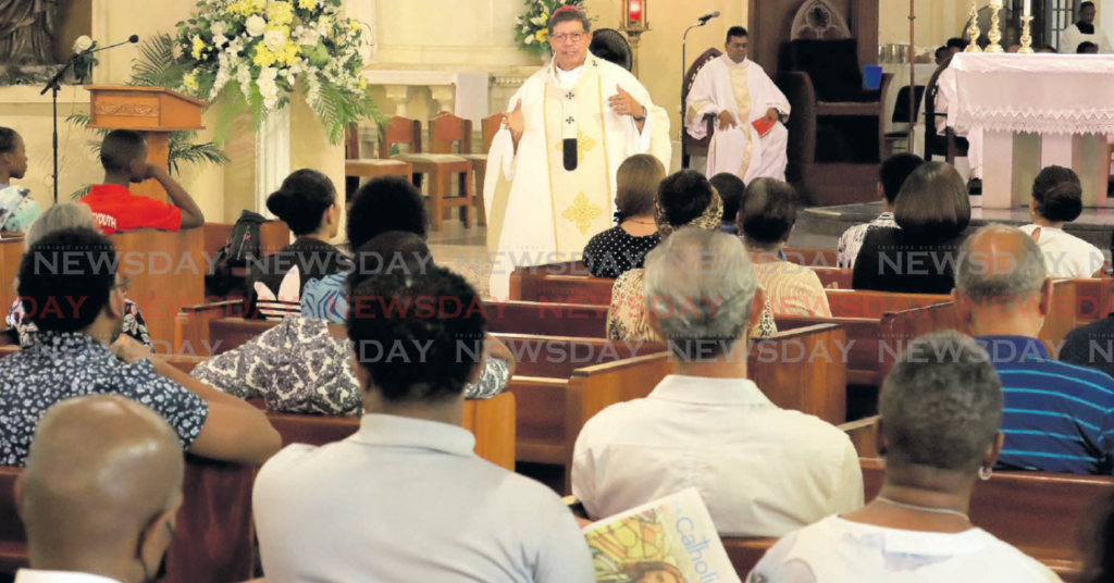 Parishoners listen intently as Archbishop Jason Gordon delivers his homily during the Holy Thursday mass at
the Cathedral of the Immaculate Conception in Port of Spain yesterday. PHOTOS BY ROGER JACOB