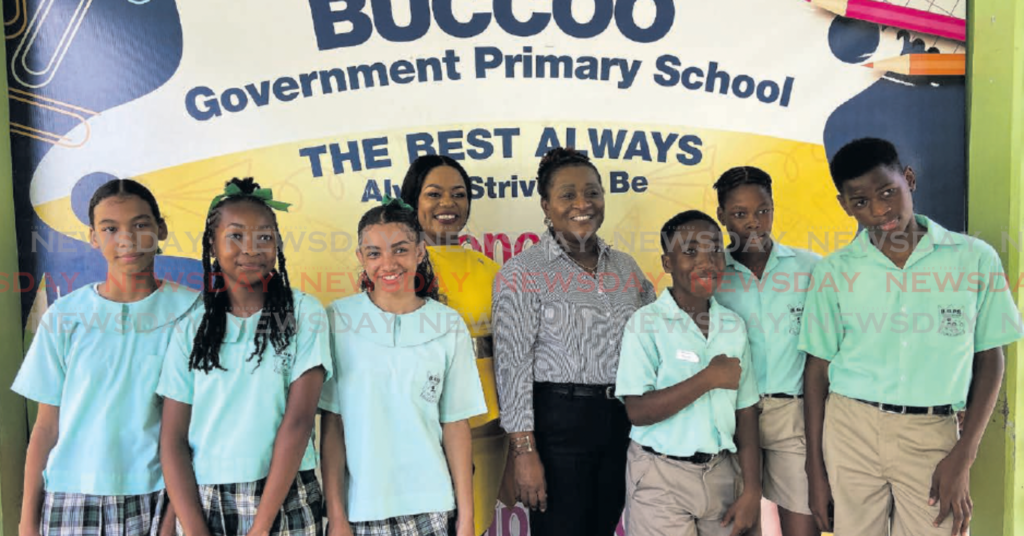 THA Education Secretary Zorisha Hackett, fourth from left, celebrates with
Buccoo Government Primary School principal Corine Smith-Rochford and
some of her students after they sat the SEA exam on Thursday.
PHOTO BY JADYN SEBRO