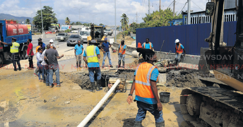 WASA workers repair a ruptured main line near the Curepe overpass in Valsayn on March 14.
PHOTO BY ROGER JACOB