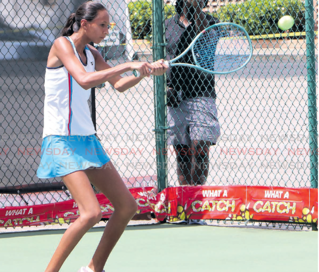 Natalia Tkachenko makes a return in her match against Malia David, in
the Catch Girls 16 and under National Junior Championship, hosted
by the Tennis Association of TT, at the National Racquet Sports Centre,
Tacarigua on March 25. - Photo by Angelo Marcelle