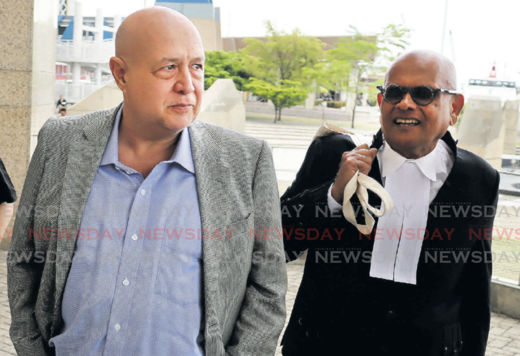 Gun dealer Brent Thomas, left, with one of his lawyers, Fyard Hosein SC, during a hearing
of a civil lawsuit at the Waterfront, in Port of Spain in May 2023. - File photo by Roger Jacob