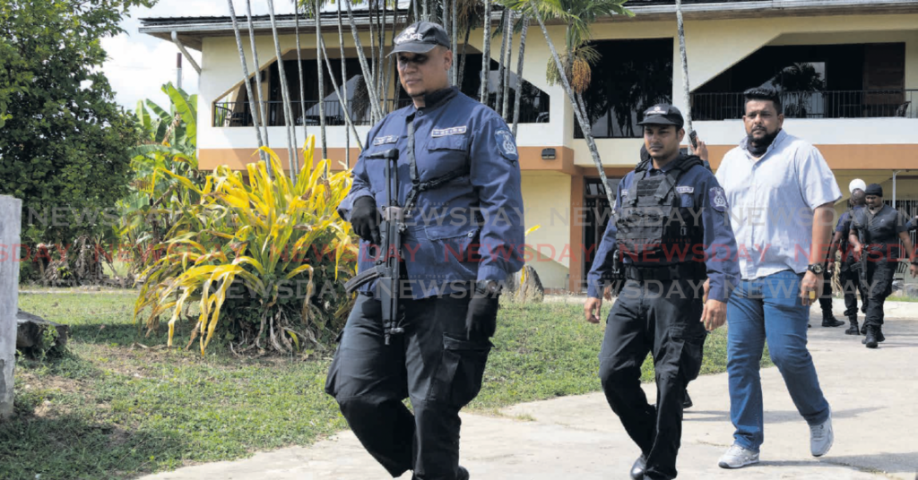 Police leaving Butu Road, Valsayn house where skeletal remains were found on March 12. Forensic scientists are working to determine whether those remains were that of missing teenager Hannah Mathura. - File photo by Faith Ayoung