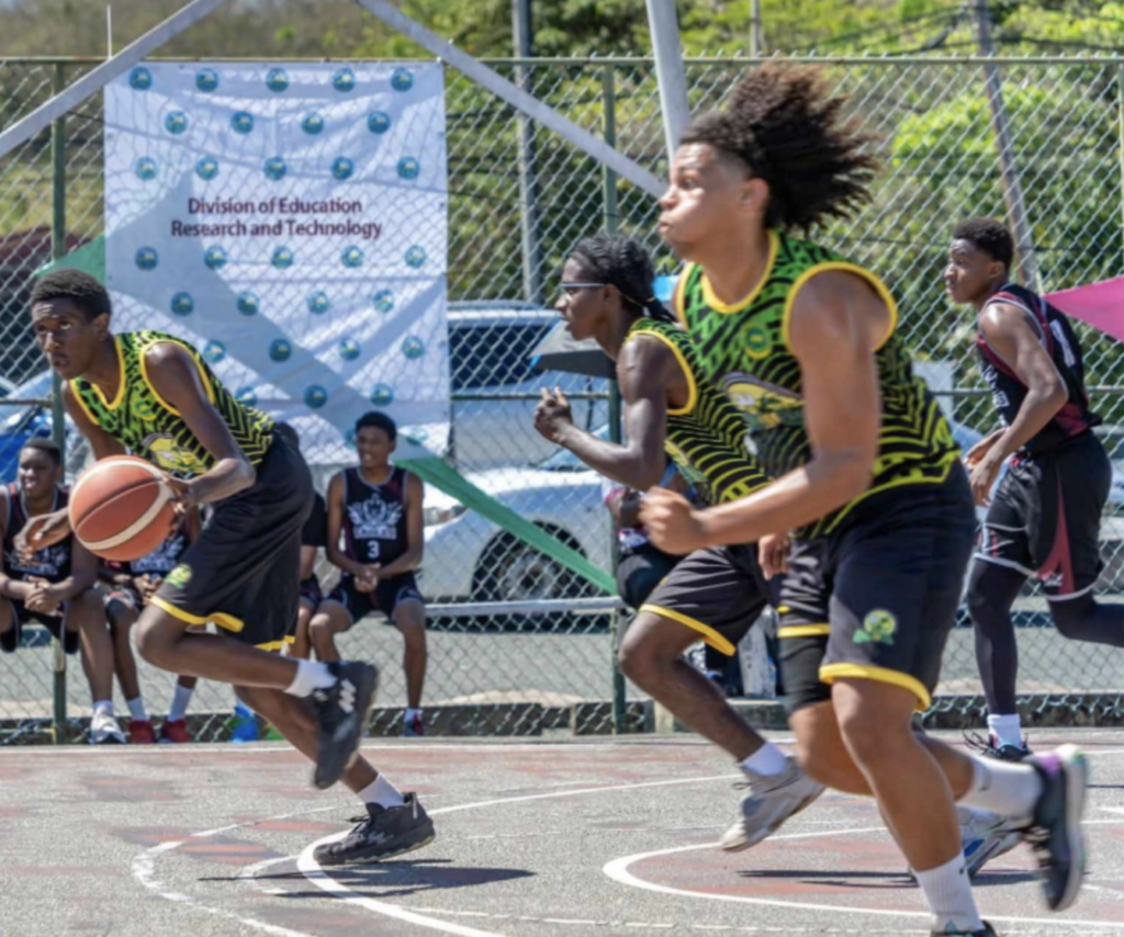 Signal Hill Secondary’s Chauncei Alleyne (L) initiates a fast break against Bishop’s High School in the Boys’ Under-20 Secondary Schools Basketball League Tobago zone final at Shaw Park, Tobago on March 13. - Photo courtesy of the Division of Education, Research, and Technology.