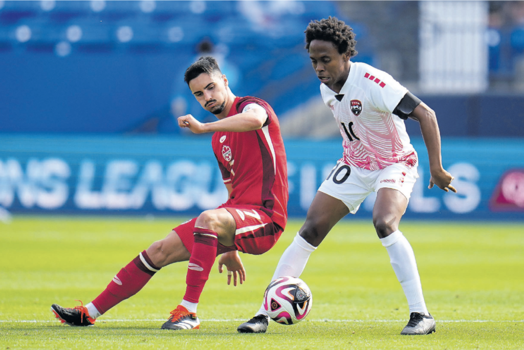Canada midfielder Stephen Eustaquio, left, and TT midfielder Real Gill, right, compete for the control of the ball in the second half of a Concacaf
Nations League Play-In match, on March 23, in Frisco, Texas. - AP PHOTO