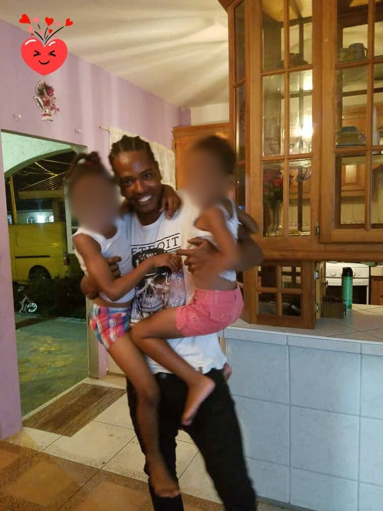 Dion Keyon Mendoza, who was murdered in Mayaro early in the morning on March 11 in happier times with his nieces. - 